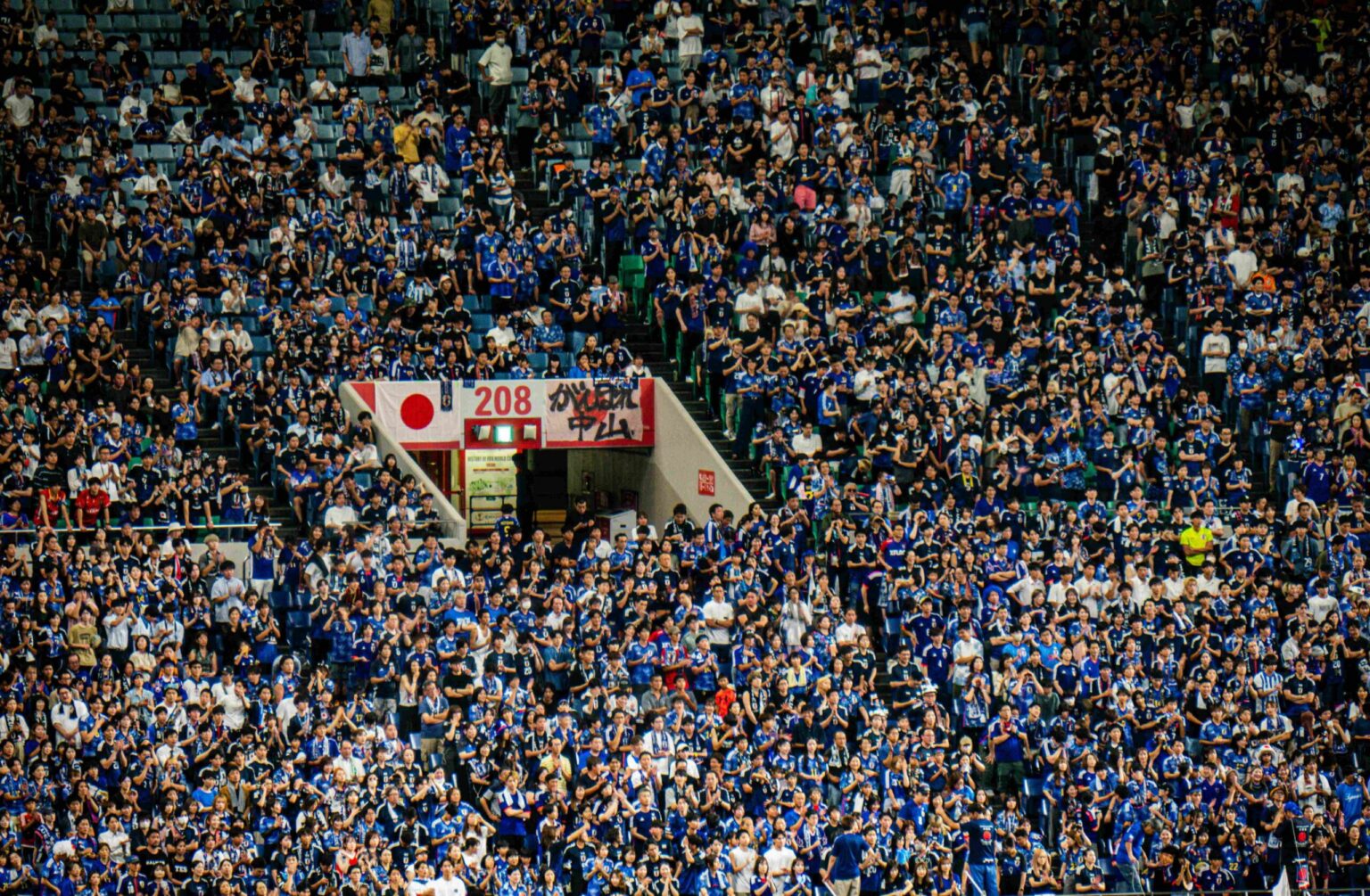 Dense crowd of spectators fill stadium seating at FIFA World Cup 2026.
