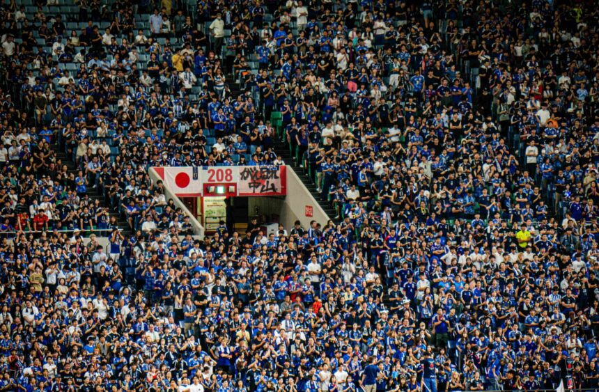 Dense crowd of spectators fill stadium seating at FIFA World Cup 2026.