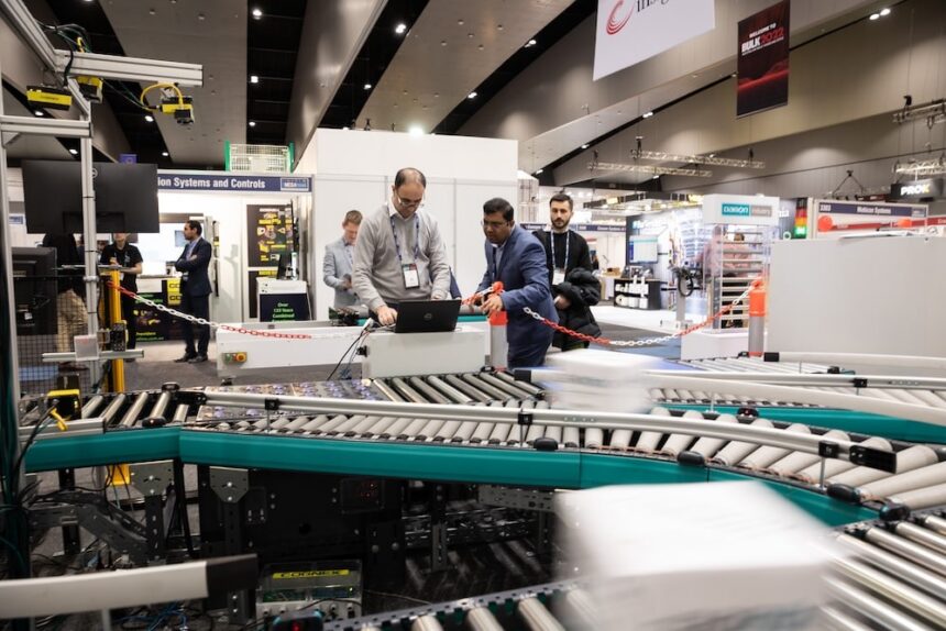 Visitors inspecting automated conveyor and materials-handling equipment at the Australian Bulk Handling Expo.