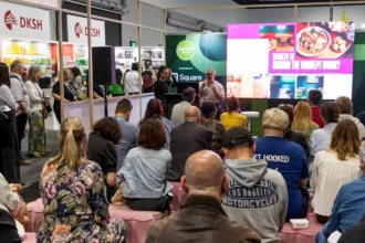 An audience watching a live presentation on the Talking Trends stage at Fine Food Australia.