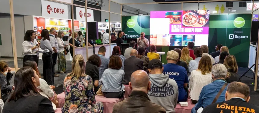 An audience watching a live presentation on the Talking Trends stage at Fine Food Australia.